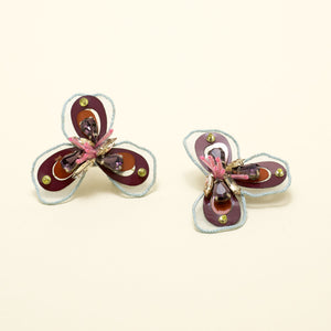 Sequin, Bead, and Crystal Red Multi Flower Stud Earrings on Cream Background