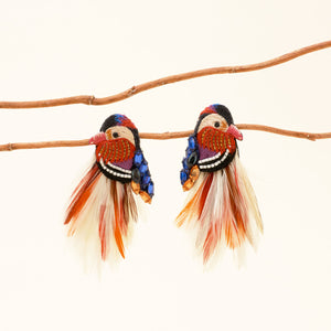 Feather Beaded and Embroidered Duck Stud Earrings Staged on Tree Branch with Cream Background