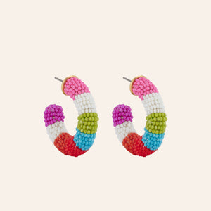 Multi Colored Beaded Hoop Earrings on Tan Background