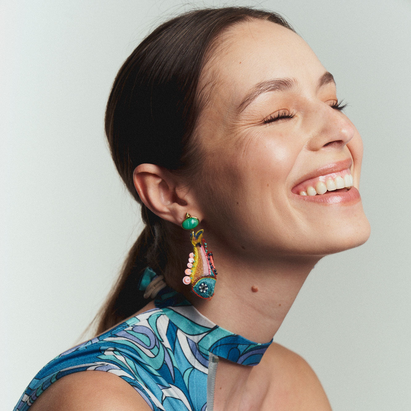 Multi-Colored Beaded and Embroidered Fish Drop Earrings Styled on Model