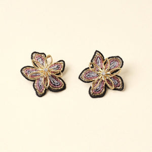 Metallic Threaded Gold Flower Studs Styled on Tan Background