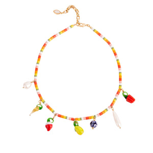 Beaded Charm Necklace with Fruit Charms and Pearls Styled on White Background