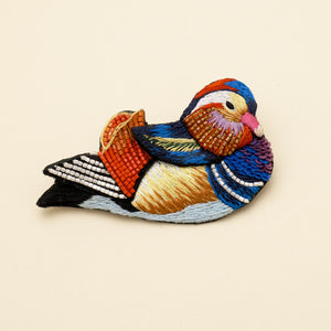 Multi-Colored Embroidered and Beaded Duck Brooch on Cream Background