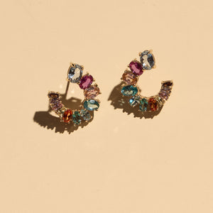 Multi-Colored Crystal Stud Earrings on Cream Background