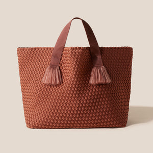 Brown Woven Tote Bag on Cream Surface