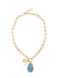 Tuquoise Shell Pendant on gold chain on white background