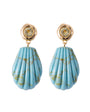 Pair of earrings with blue teardrop-shaped stones and gold accents on a white background