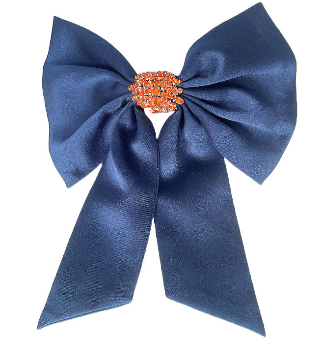 Navy and Orange Crystal Hair Bow on Flat White Background