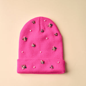 Neon Pink Beanie with Pearls and Crystals on Tan Background