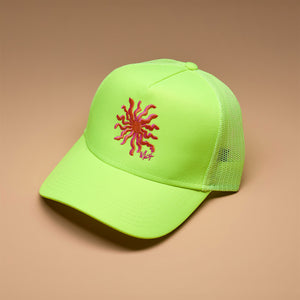 Neon Yellow Trucker Hat with Sun Embroidery on Tan Background