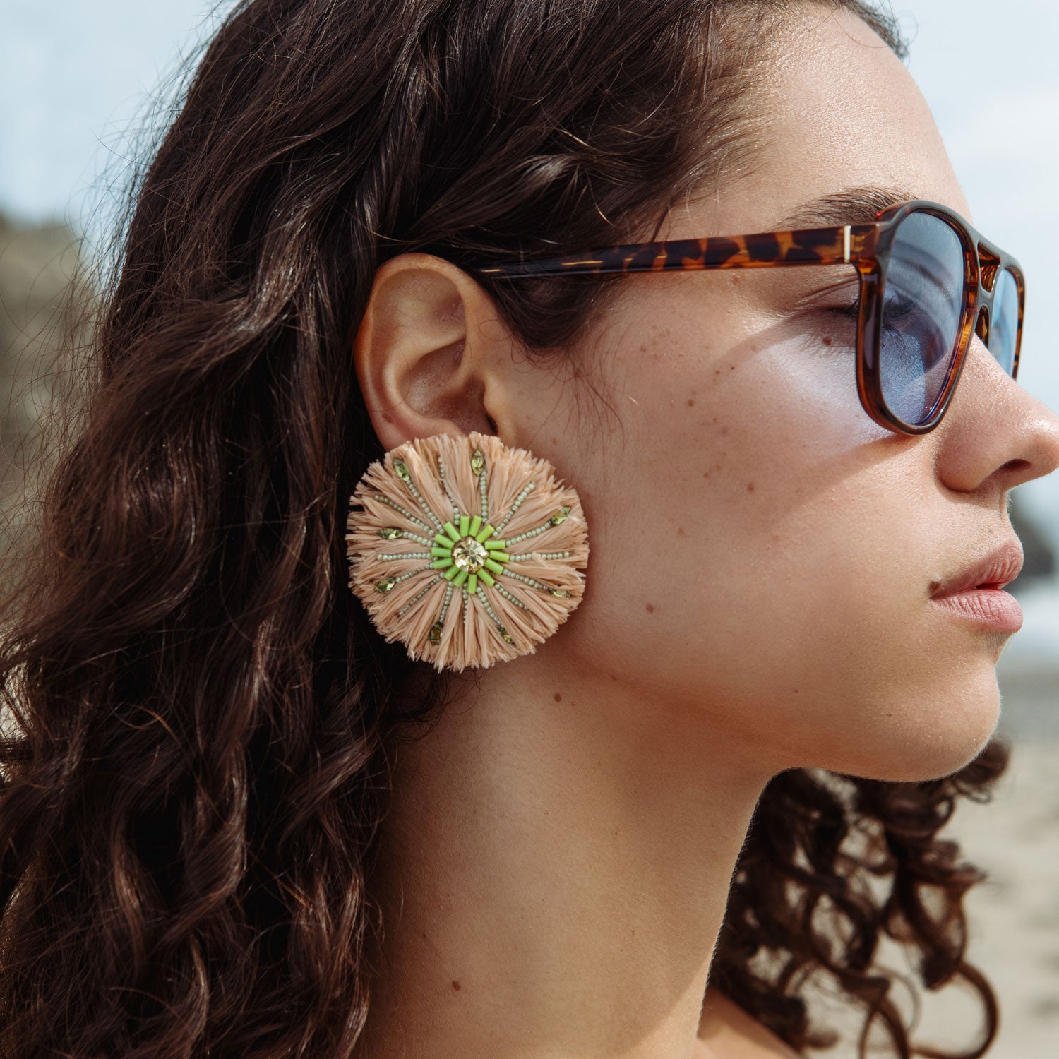 Raffia and Green Beaded Oversized Stud Earrings Styled on Model