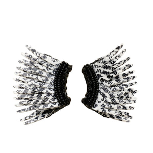 Black and White Newspaper Print Sequin Wing Earrings on Flat White Background