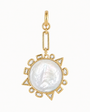 A gold pendant featuring a large, round, lustrous white pearl surrounded by a geometric gold border with small clear stones, suspended from a gold chain on a plain white background.
