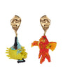 Pair of colorful fish-shaped earrings on a white background