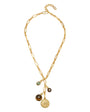 A gold-toned paperclip chain necklace with three dangling charms: a round brown gemstone pendant, a small oval brown pendant, and a circular gold medallion, shown on a plain white background.