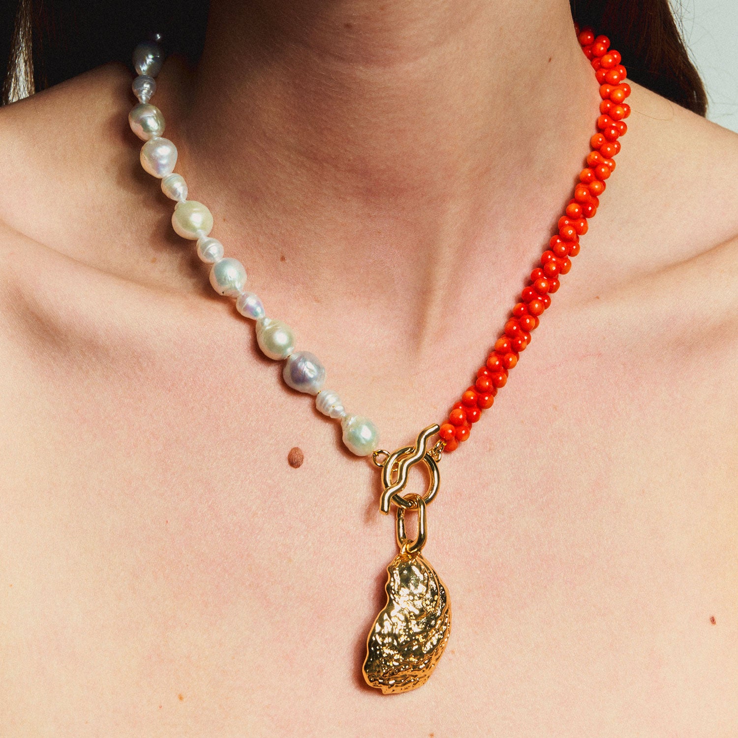 Orange Bead and Freshwater Pearl with Gold Oyster Shell Charm Pendant Necklace Styled on Model