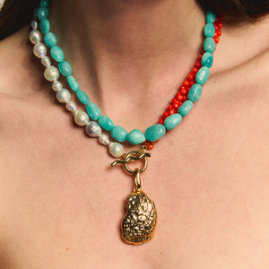 Orange Bead and Freshwater Pearl with Gold Oyster Shell Charm Pendant Necklace Styled on Model
