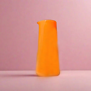 Orange Glass Vase on Pink Background