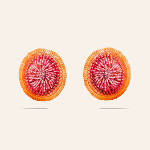 Orange and Pink Sequin and Bead Stud Earrings on Tan Background