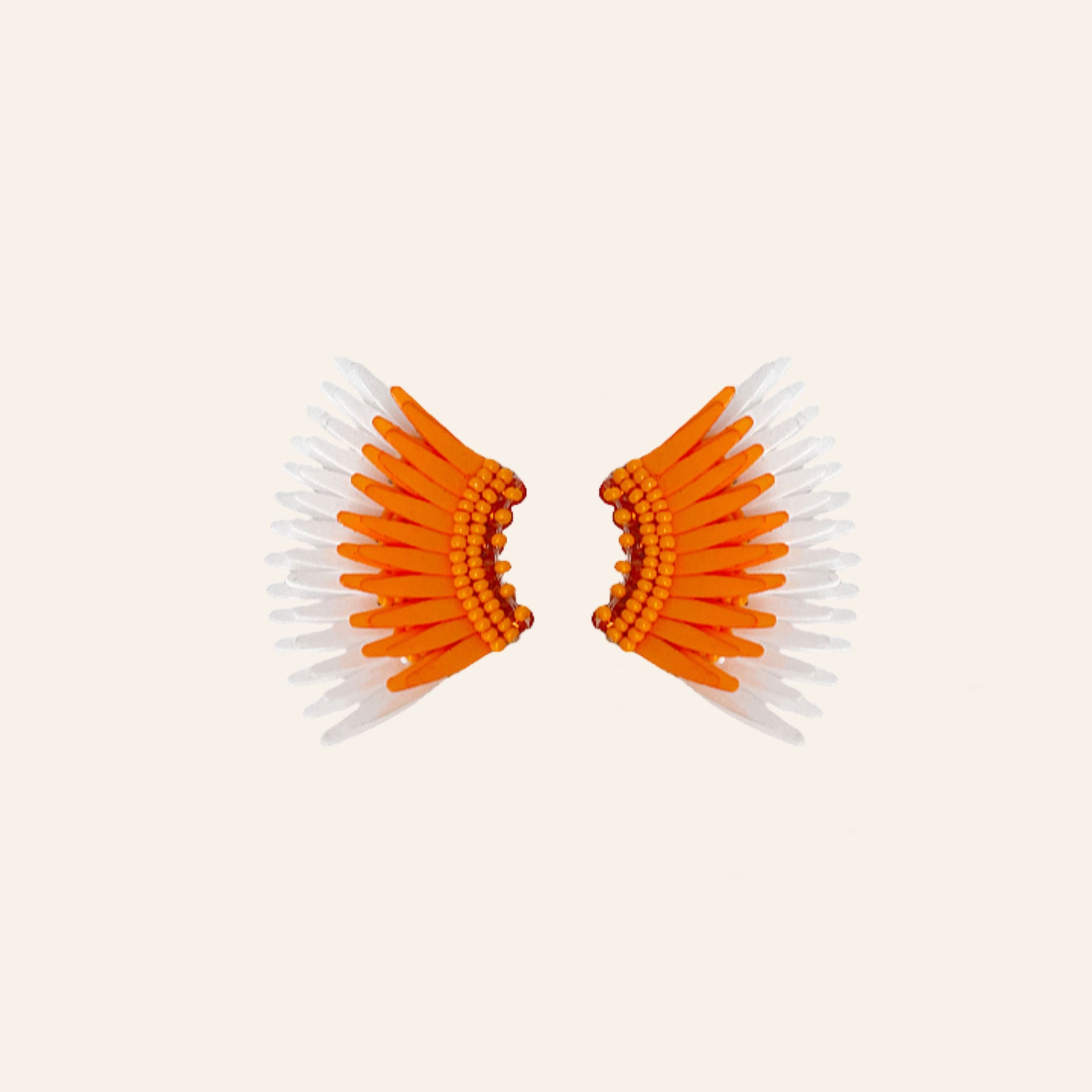 Orange and White Sequin Wing Stud Earrings on Tan Background