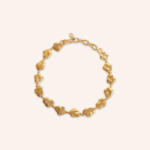 Hammered Gold Chain Necklace on Cream Background