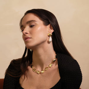 Hammered Gold Chain Necklace Styled on Model with Gold and Pearl Drop Earrings