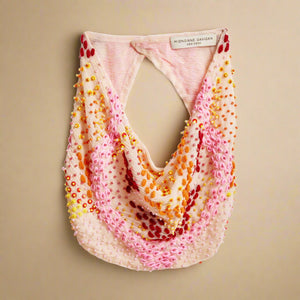 Peachy Pink Scarf Necklace with Red, Pink, Yellow, and Orange Beading and Embroidery Scarf Necklace on Tan Background
