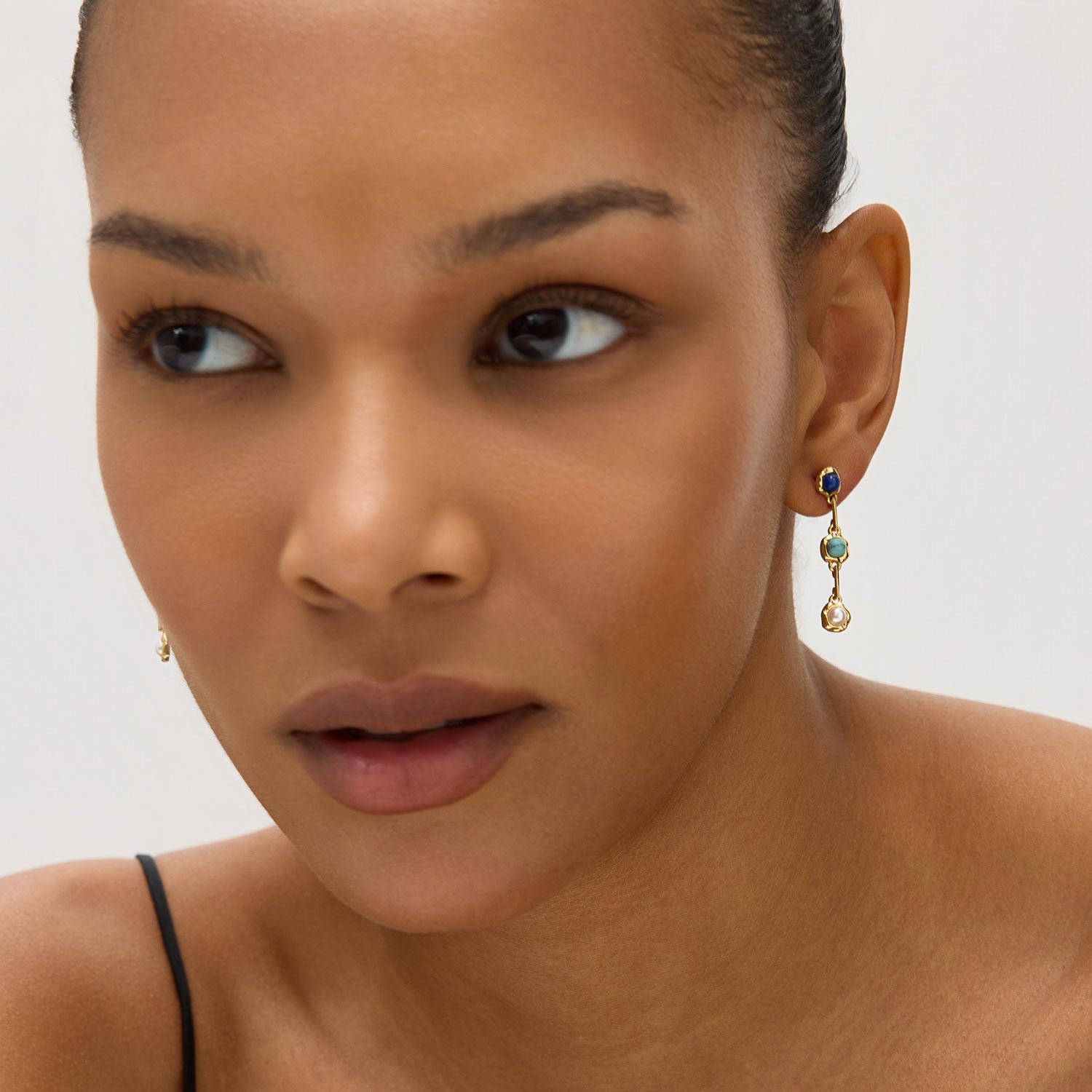 Stone and Pearl Gold Drop Earrings Styled on Model