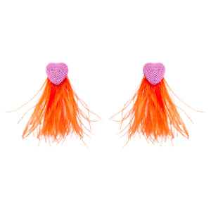 Pink Beaded Heart Earrings with Red Statement Feathers on Flat White Background