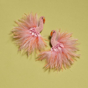 Feather and Beaded Pink Bird Earrings on Green Background