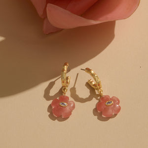 Pink Flower Stone and Crystal Gold Hoop Drop Earrings Staged on Cream Flat Background with Pink Flower