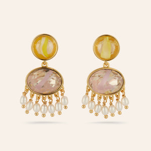 Crystal and Pearl Drop Earrings on Tan Background