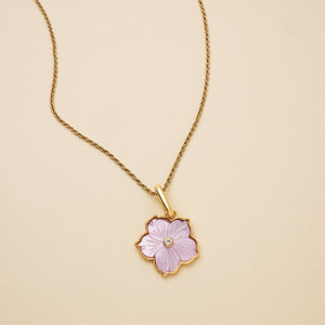 Purple Flower Charm on Chain Staged on Flat Cream Background