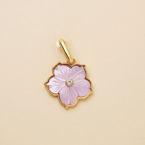 Purple Flower Charm with Crystal Center Staged on Flat Cream Background