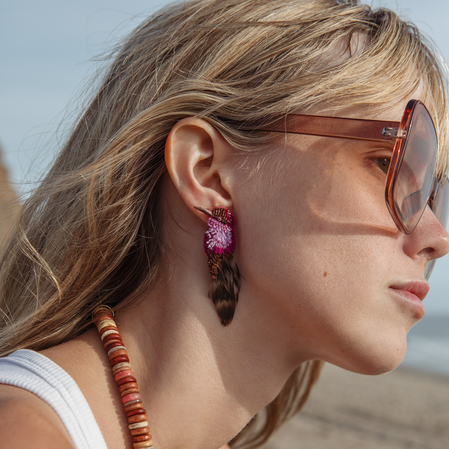 Purple and Brown Beaded and Embroidered Bird Stud Earrings Styled on Model