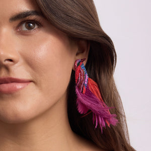 Red, Purple, and Blue Feather, Bead, and Thread Embroidered Bird Stud Earrings on Model