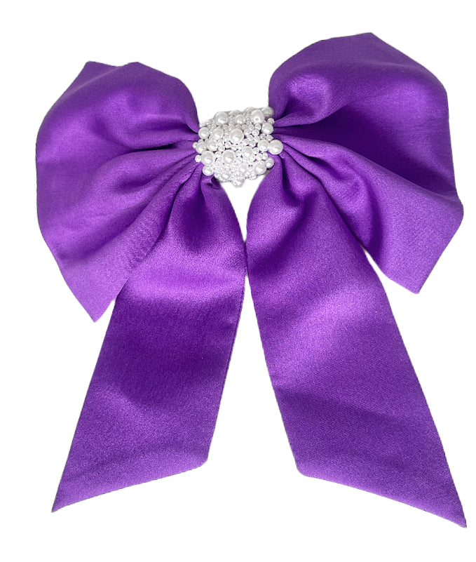 Purple and White Pearl Hair Bow on Flat White Background