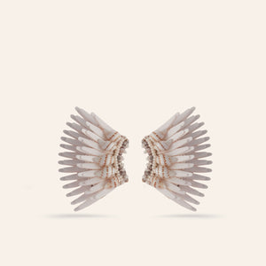 Cream Sequin, Shell, and Bead Wing Stud Madeline Earrings on Tan Background