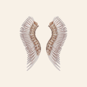Cream Sequin, Bead, and Shell Wing Statement Madeline Earrings on Tan Background
