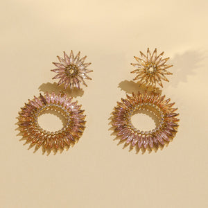 Crystal Double Drop Earrings in Champagne Pink and Purple on Flat Cream Background