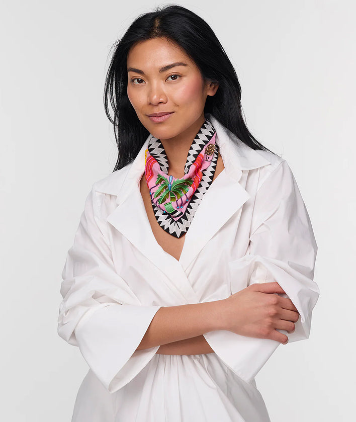 Woman wearing a colorful scarf with a white background