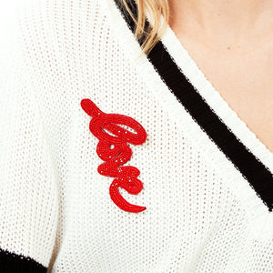 Red Beaded and Embroidered Love Brooch Styled on Model's Sweater