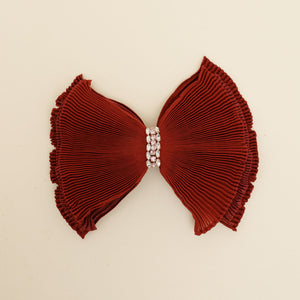 Red Pleated Hairbow with Crystal Center Accent on Tan Background