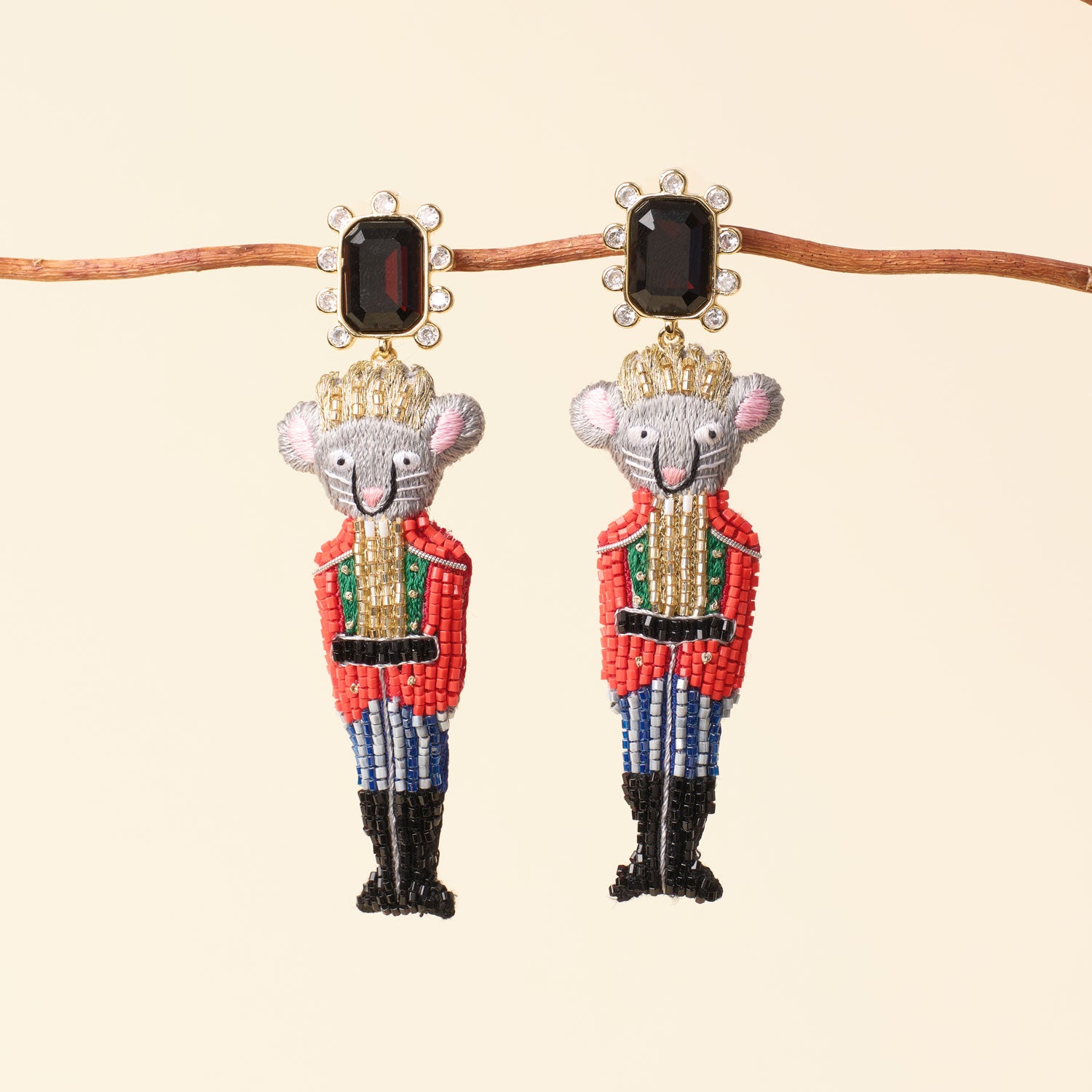 Rat King Nutcracker Drop Earrings Staged on Branch with Tan Background