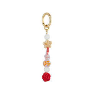 Red, Pink, White, Neutral Beaded Bag Charm on Flat White Background