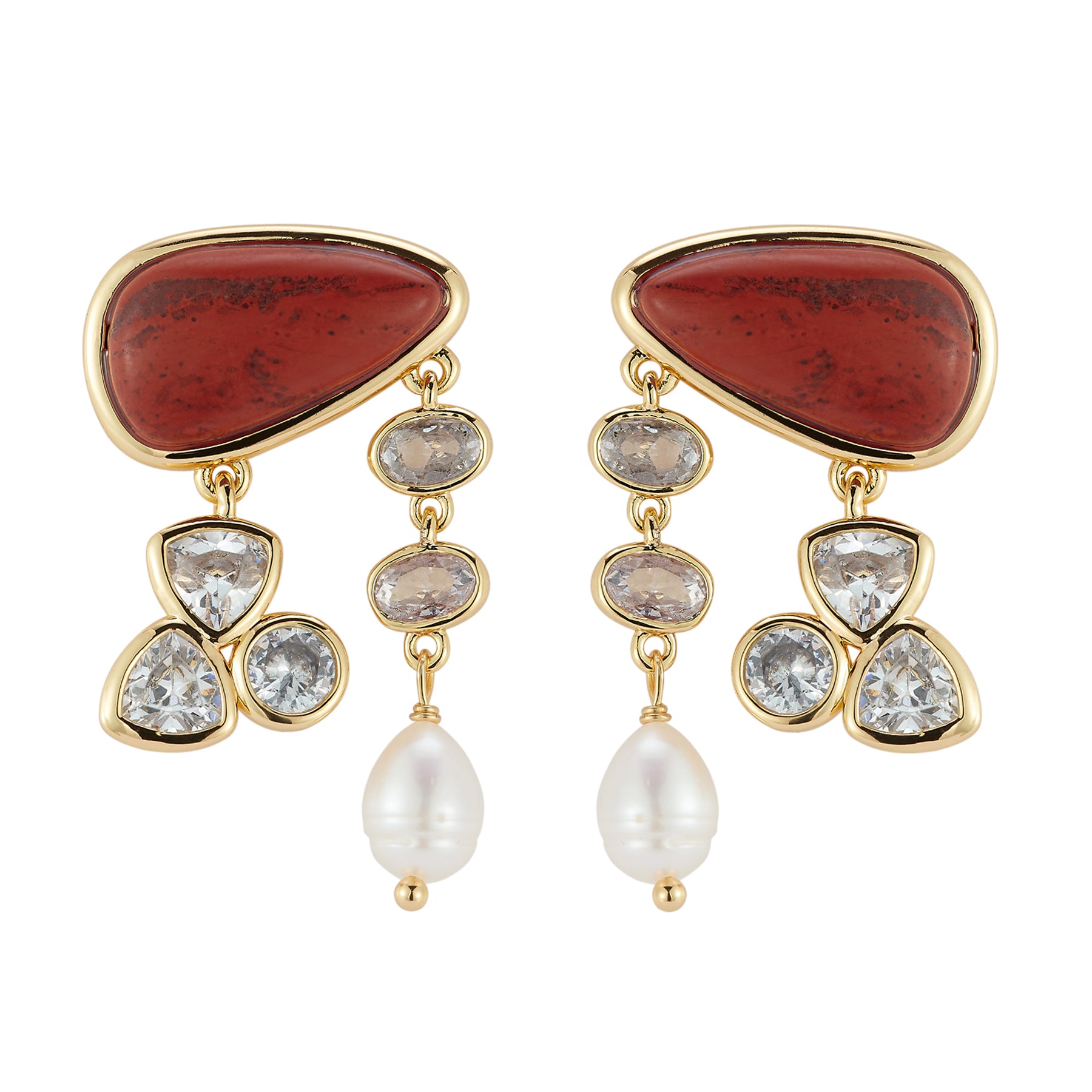 Pair of earrings with red stone, gold accents, and pearls on a white background