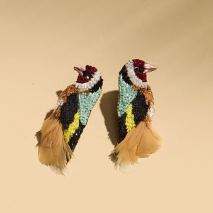 Multi-Colored Bead and Feather Bird Earrings on  Tan Background