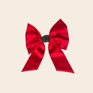 Red and Black Crystal Hair Bow on Tan Background