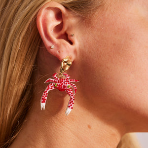 Red and White Beaded and Embroidered Crab Drop Earrings on Model's Ear