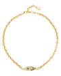 Gold chain necklace with a unique clasp on a white background